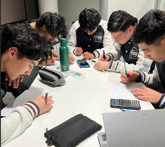 Mentra Academy students completing mathematics practice during a tutoring class.